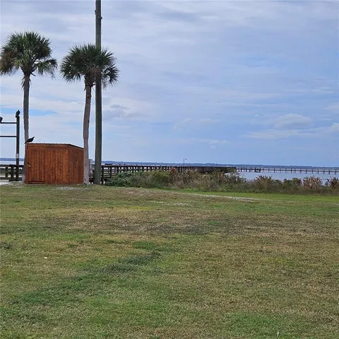a view of a swimming pool and a yard
