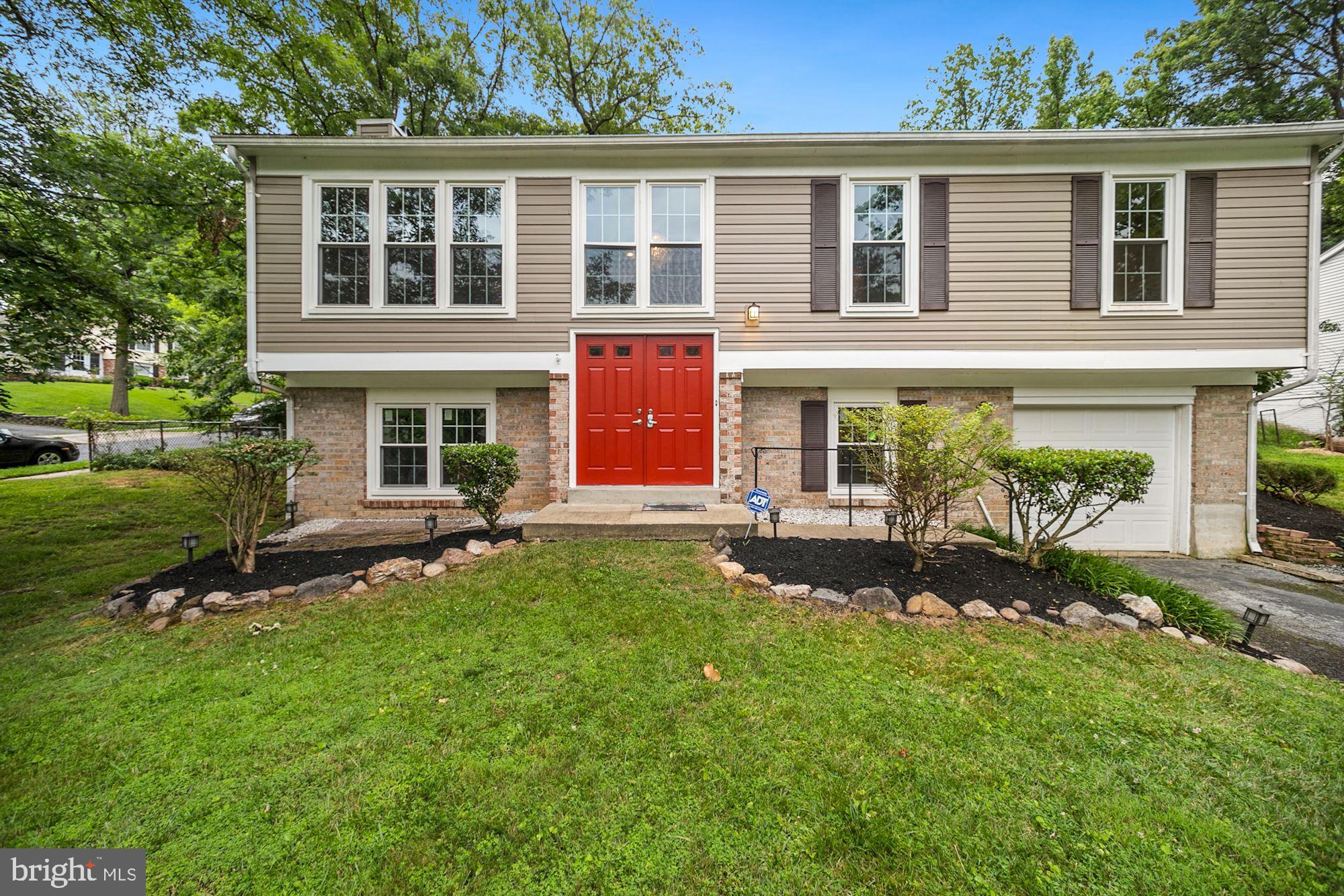 8429 Oak Stream Drive Laurel, MD 20708 - Photo 1 of 37 Front view of home with red door