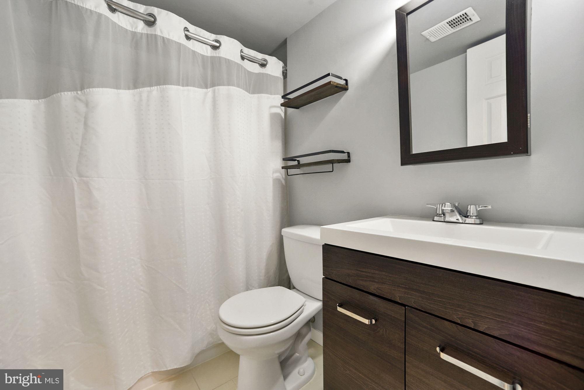 8429 Oak Stream Drive Laurel, MD 20708 - Photo 27 of 37 Lower level full bathroom has fresh updates