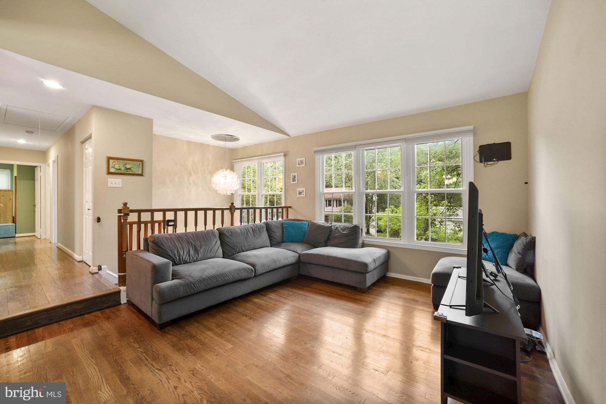 8429 Oak Stream Drive Laurel, MD 20708 - Photo 6 of 37 LR with large windows and cathedral ceilings