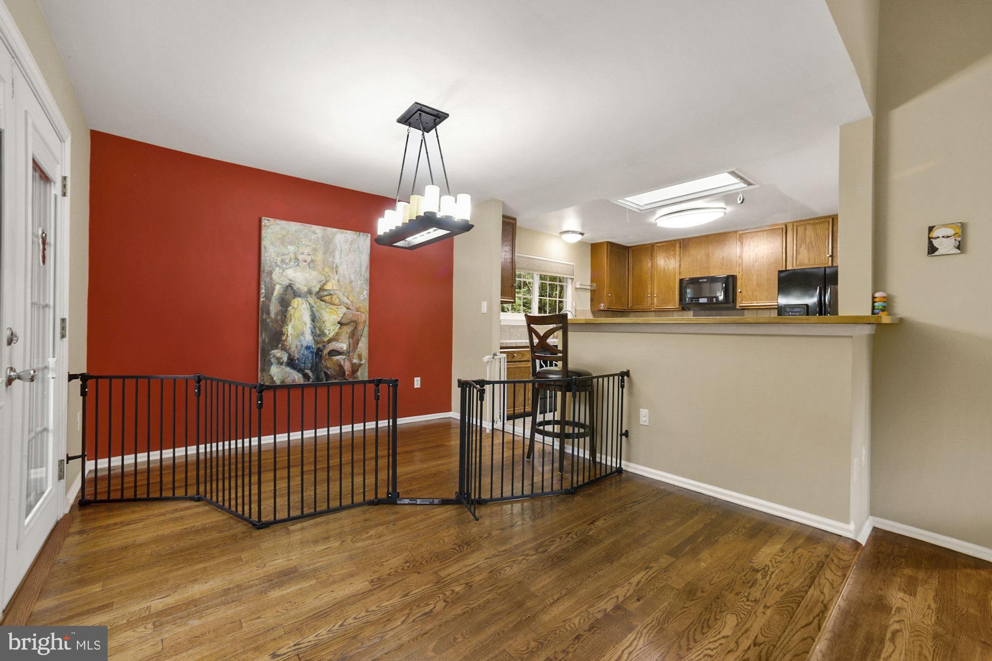 8429 Oak Stream Drive Laurel, MD 20708 - Photo 9 of 37 Open airy feeling between dining room and kitchen