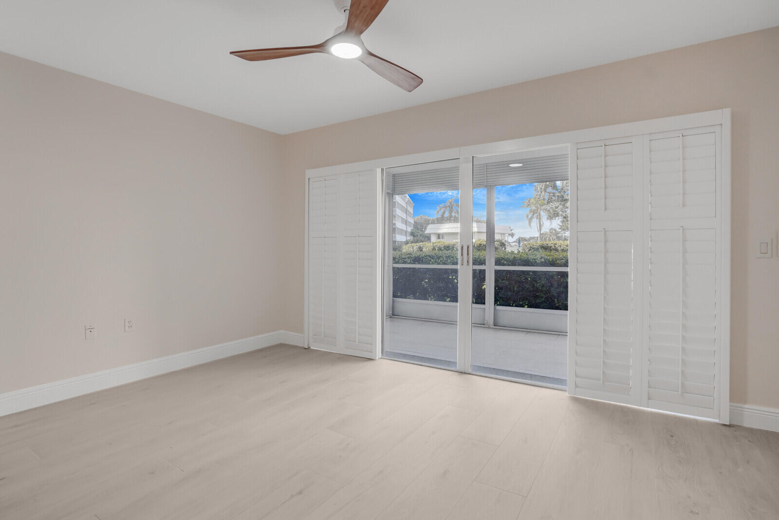 145 Atlantis Boulevard, Unit 104 Atlantis, FL 33462 - Photo 17 of 49 an empty room with a empty space and windows