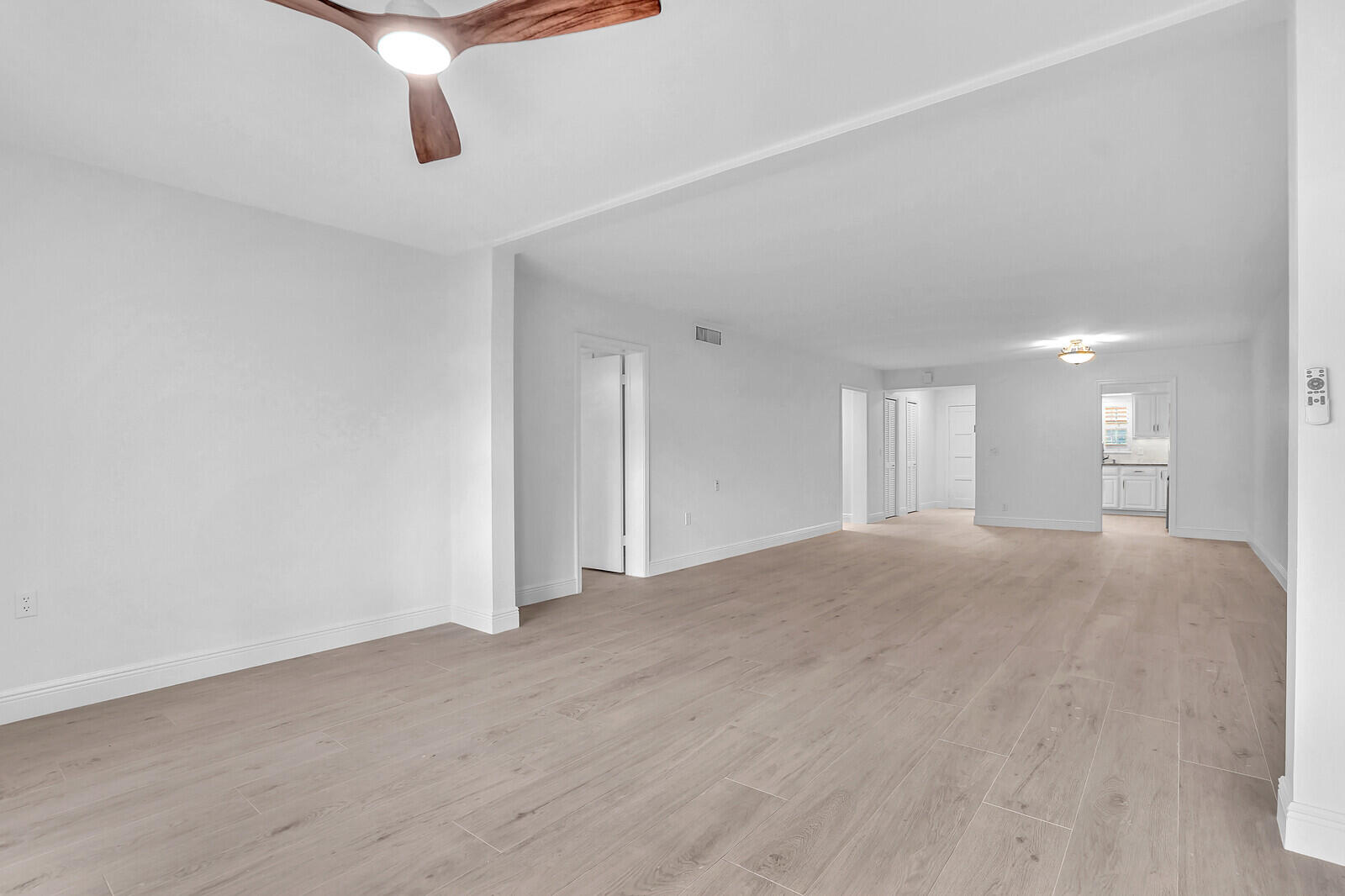 145 Atlantis Boulevard, Unit 104 Atlantis, FL 33462 - Photo 19 of 49 a view of empty room with window