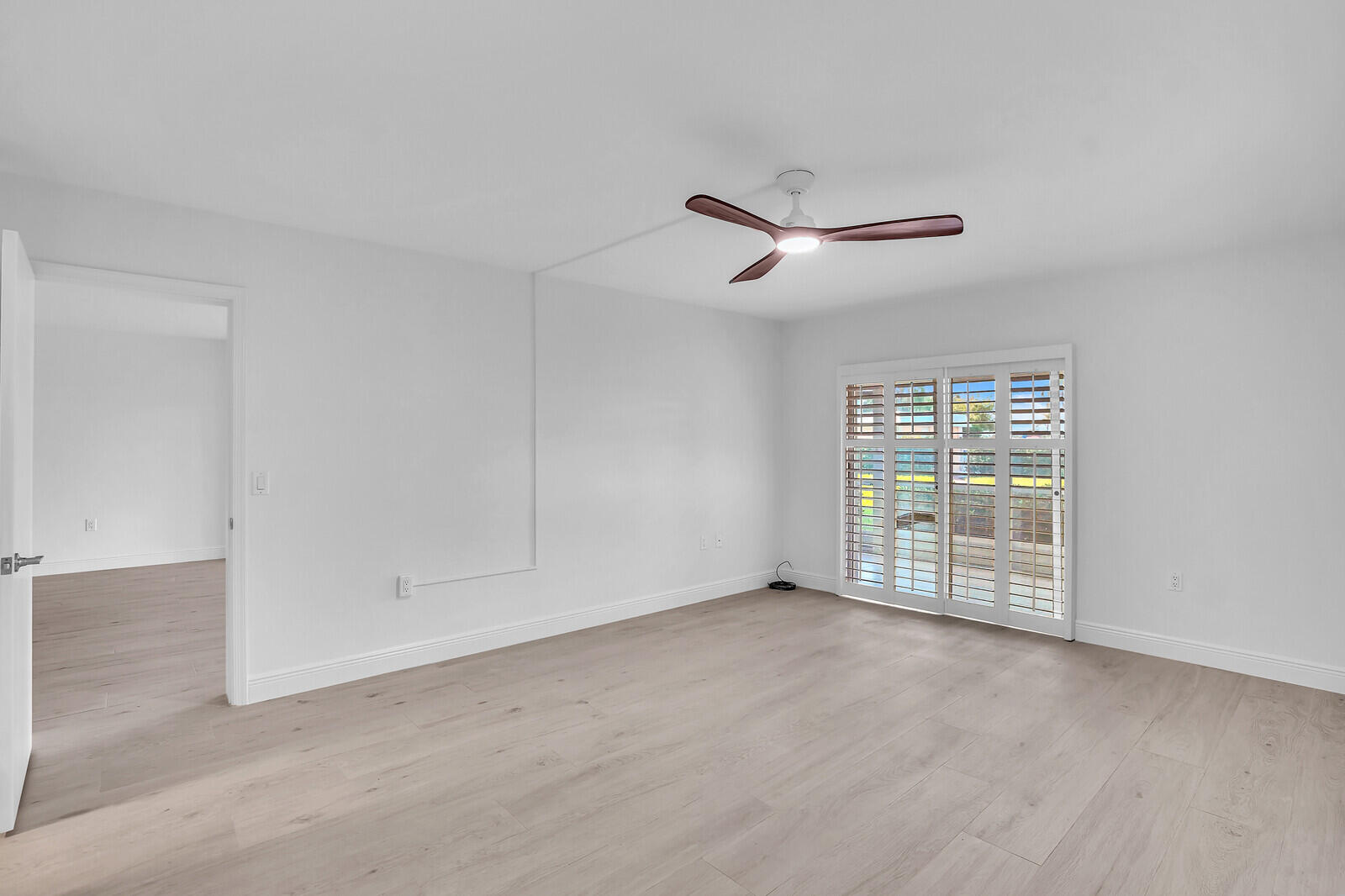 145 Atlantis Boulevard, Unit 104 Atlantis, FL 33462 - Photo 29 of 49 a view of an empty room with a window