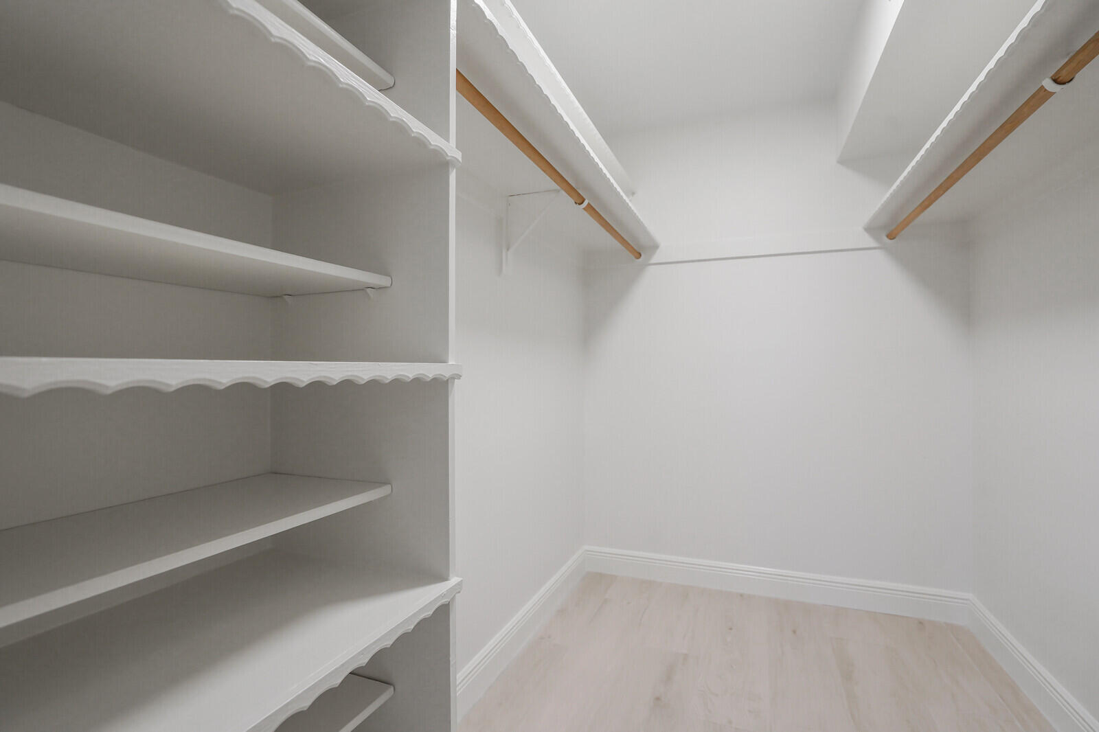 145 Atlantis Boulevard, Unit 104 Atlantis, FL 33462 - Photo 33 of 49 a view of an empty walk in closet