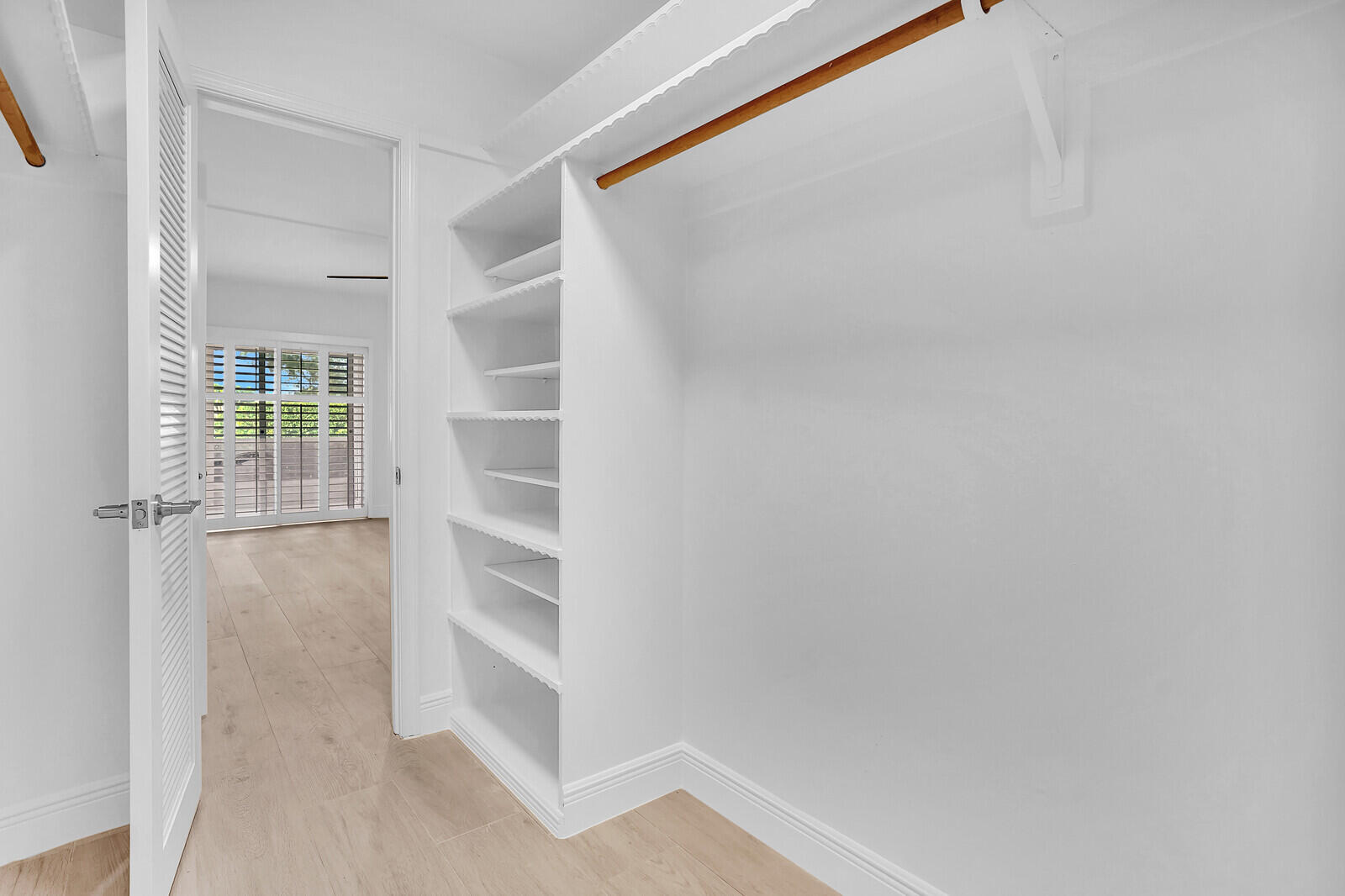 145 Atlantis Boulevard, Unit 104 Atlantis, FL 33462 - Photo 34 of 49 a view of an empty walk in closet