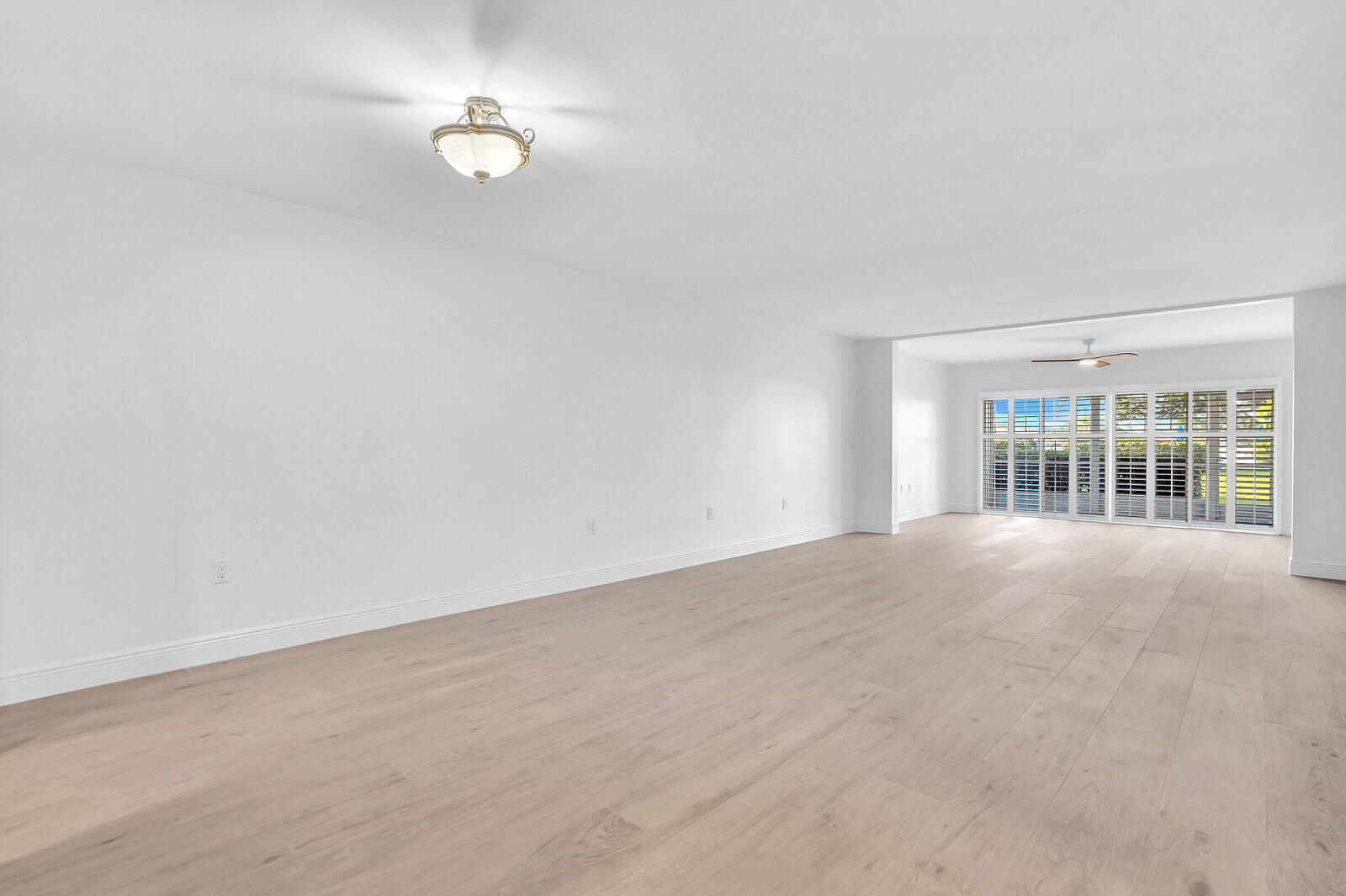 145 Atlantis Boulevard, Unit 104 Atlantis, FL 33462 - Photo 4 of 49 a view of an empty room with a window