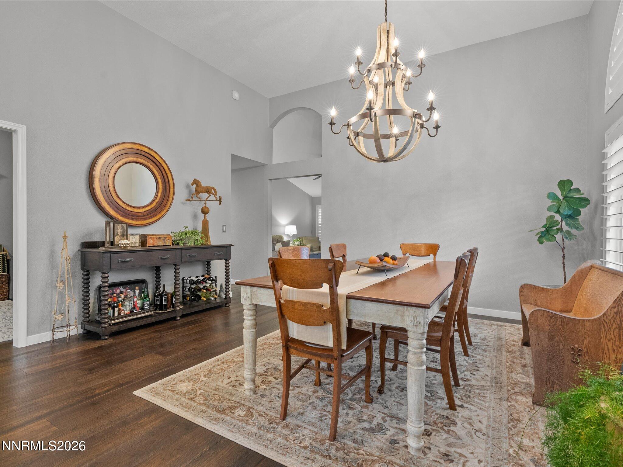 1164 Mayflower Drive Reno, NV 89509 - Photo 20 of 89 a dining room with furniture a fireplace and a chandelier
