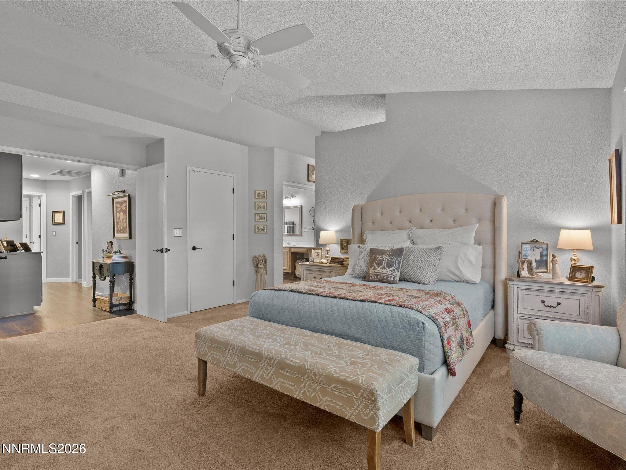 1164 Mayflower Drive Reno, NV 89509 - Photo 30 of 89 a spacious bedroom with a bed and a couch