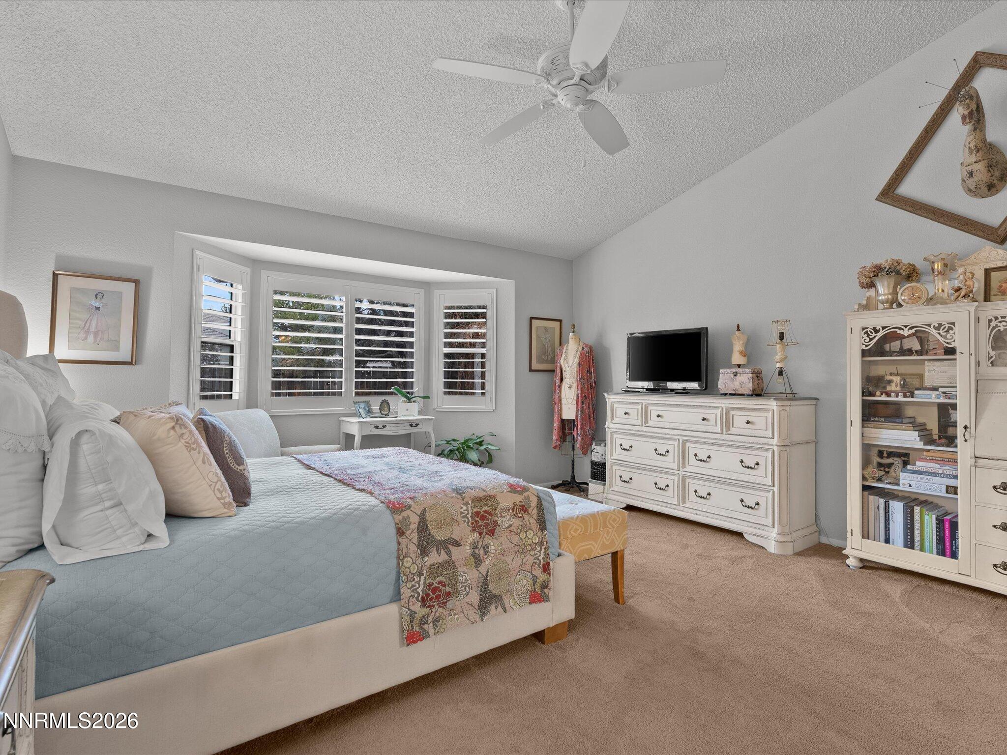 1164 Mayflower Drive Reno, NV 89509 - Photo 31 of 89 a bedroom with a bed a flat screen tv and a window