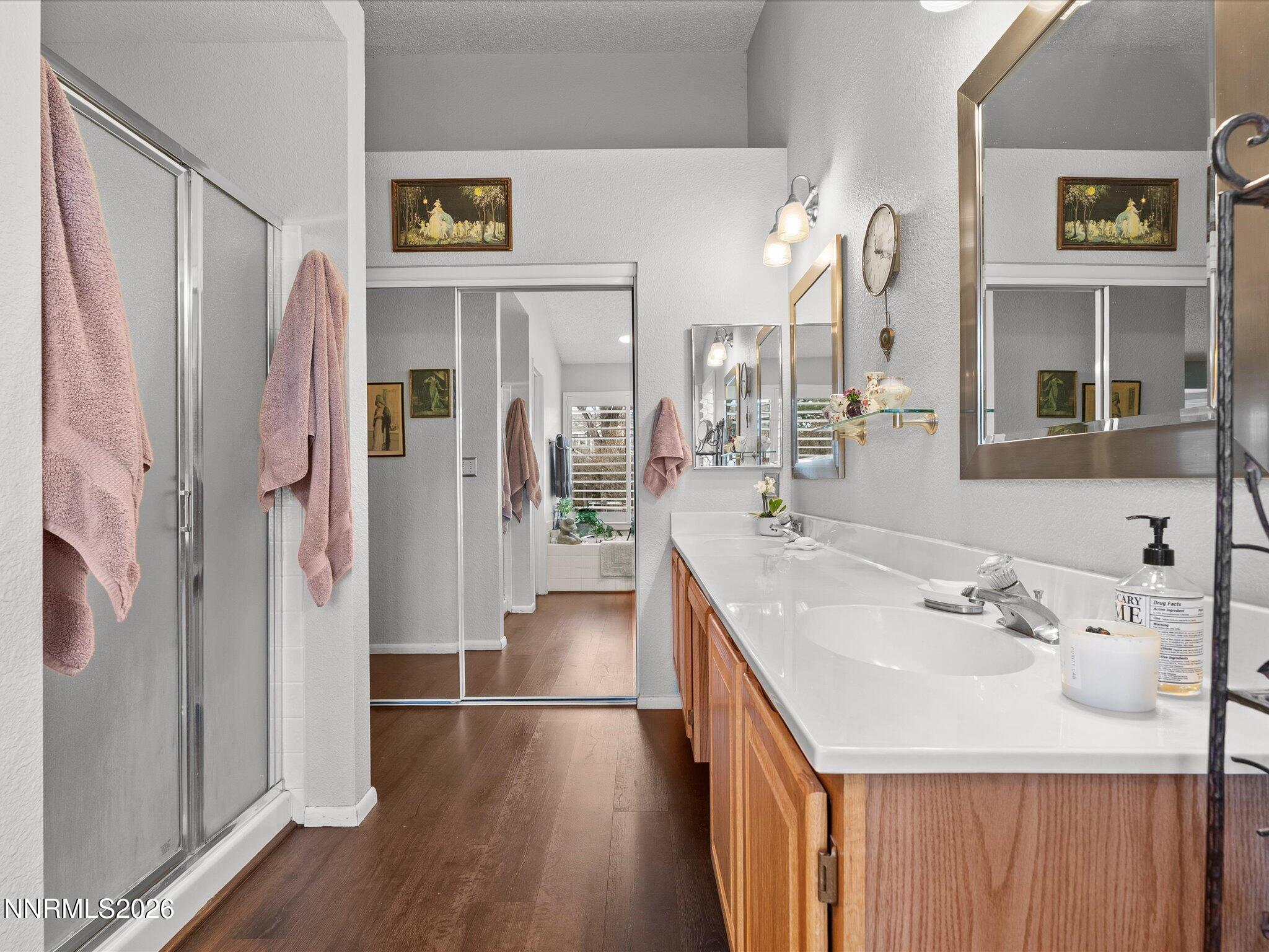 1164 Mayflower Drive Reno, NV 89509 - Photo 33 of 89 a bathroom with a sink a mirror and a shower