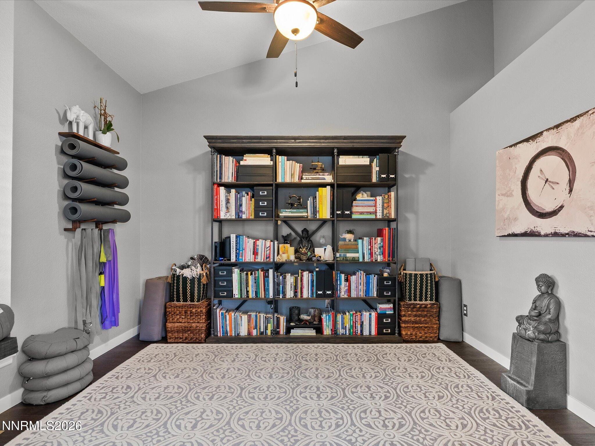 1164 Mayflower Drive Reno, NV 89509 - Photo 35 of 89 a living room with lots of books and a book shelf