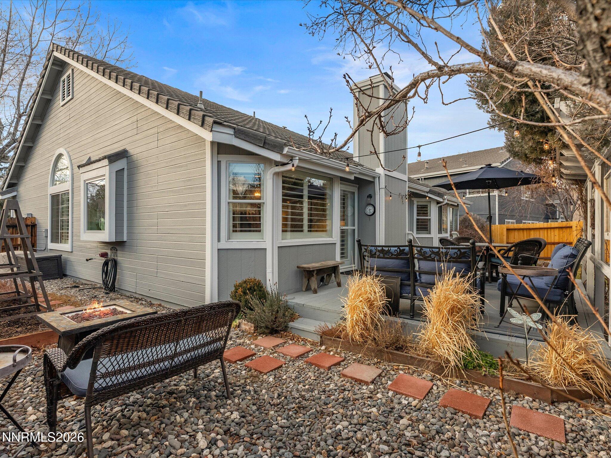1164 Mayflower Drive Reno, NV 89509 - Photo 46 of 89 a view of a patio with table and chairs with wooden floor and fence