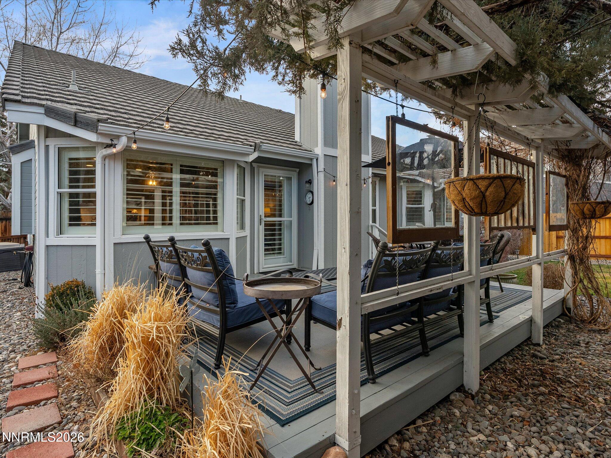 1164 Mayflower Drive Reno, NV 89509 - Photo 47 of 89 a view of a patio with table and chairs and potted plants