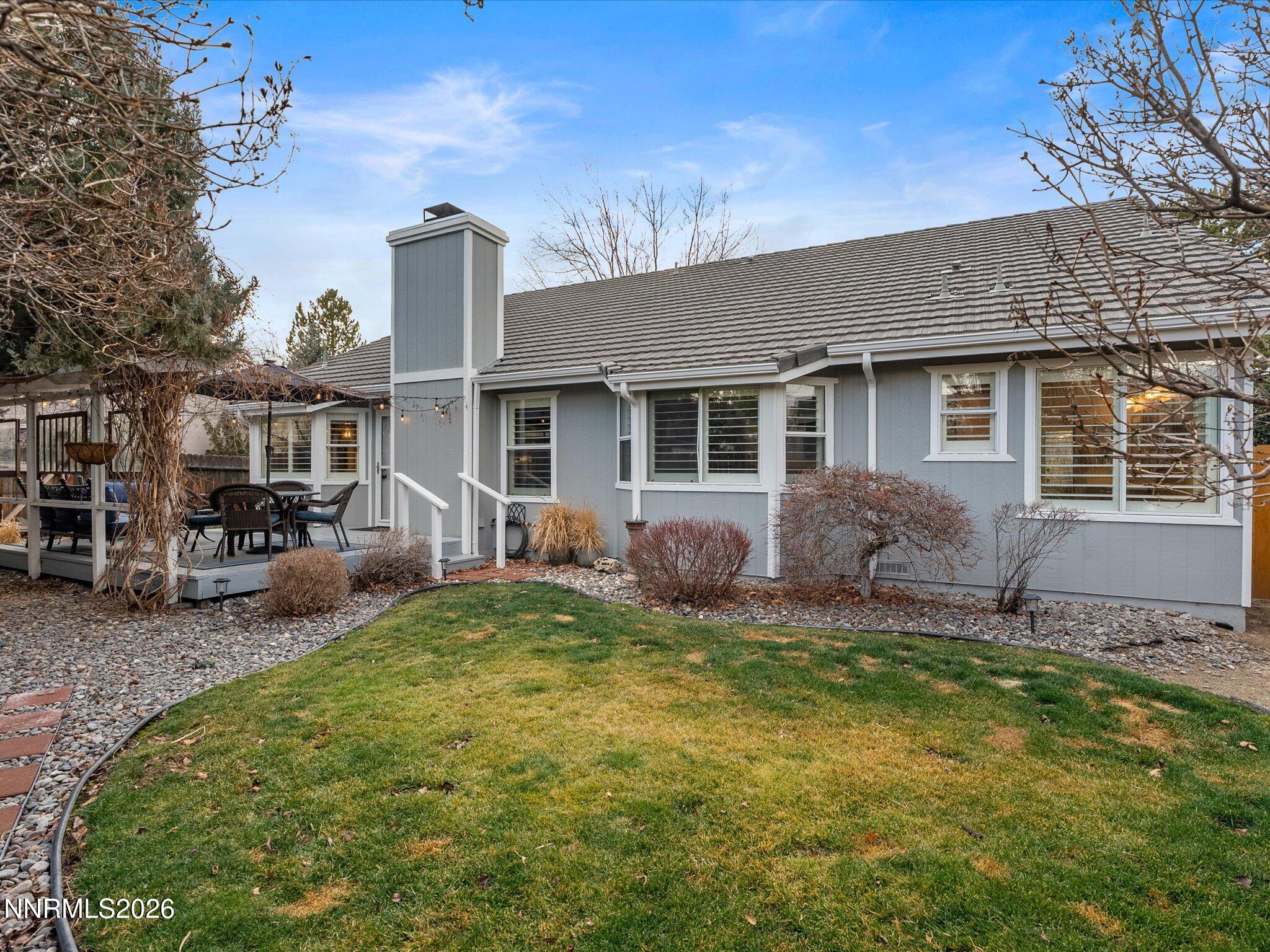 1164 Mayflower Drive Reno, NV 89509 - Photo 48 of 89 a backyard of a house with yard table and chairs