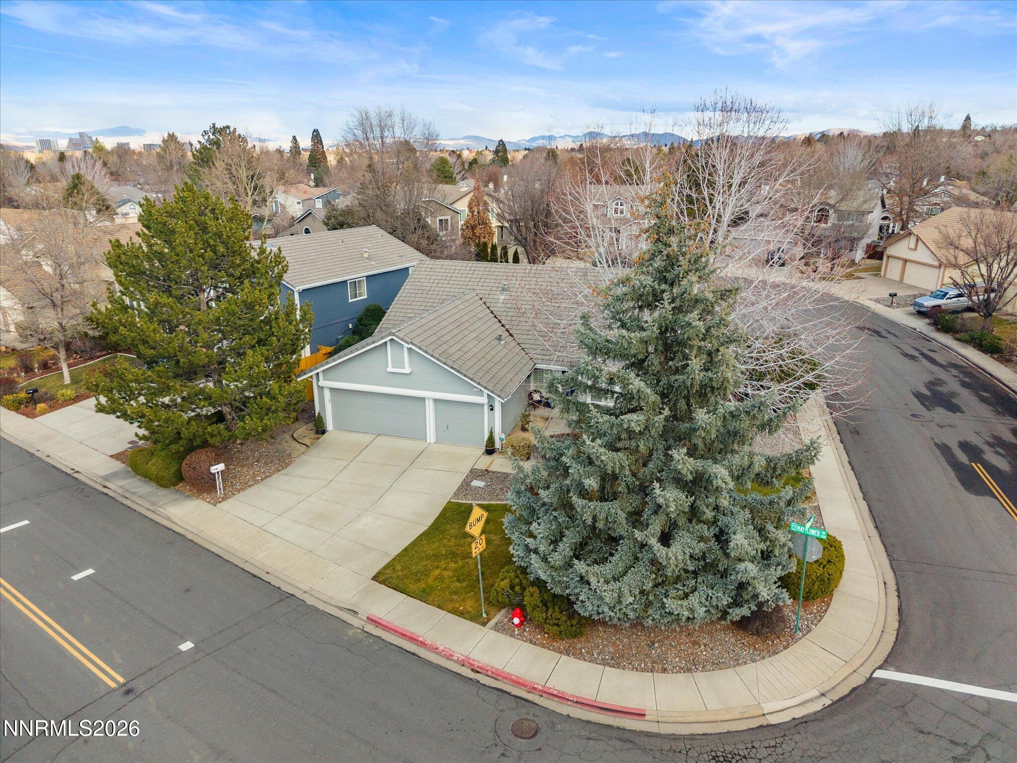 1164 Mayflower Drive Reno, NV 89509 - Photo 52 of 89 a view of a house with a yard and potted plants