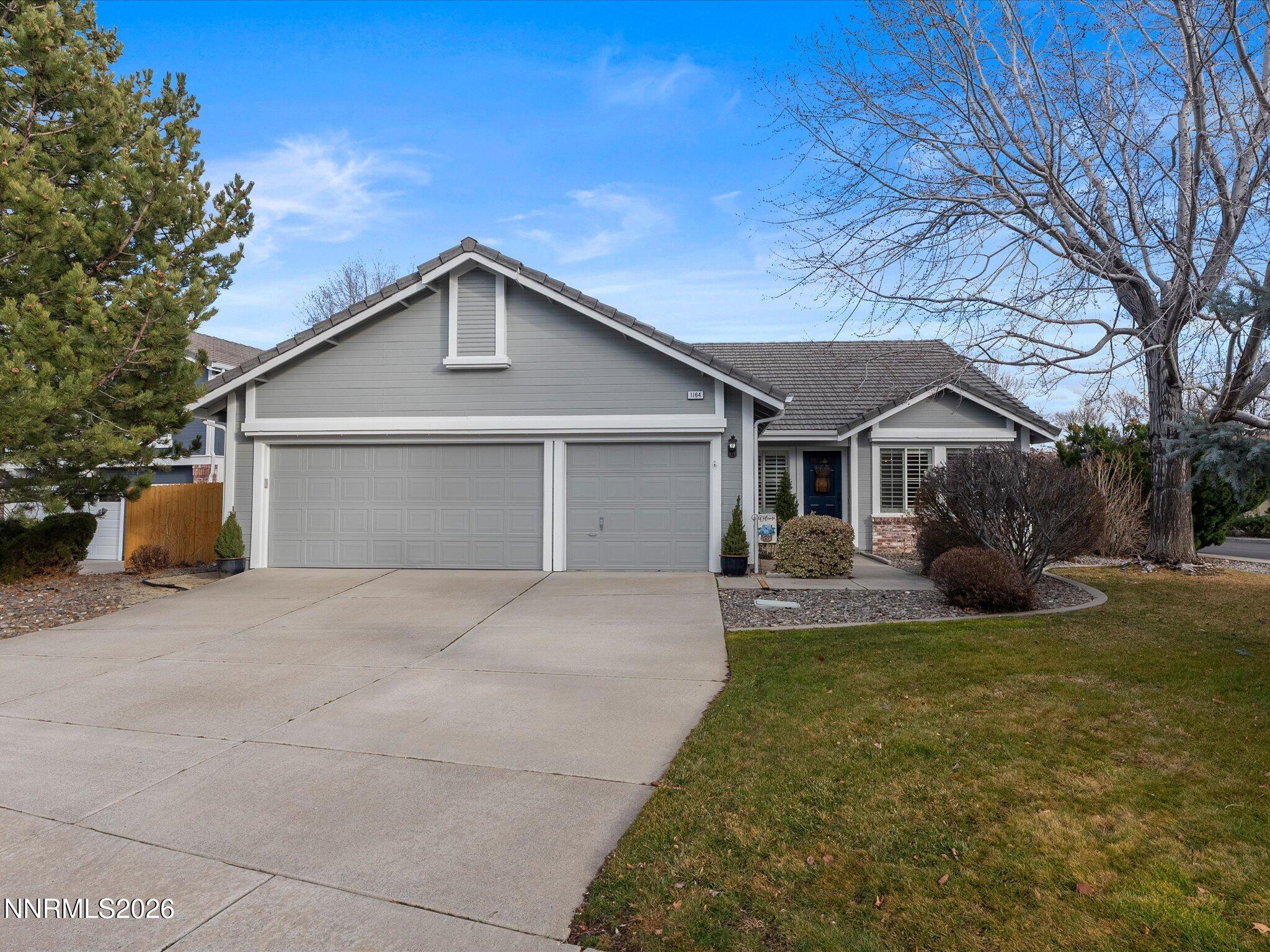 1164 Mayflower Drive Reno, NV 89509 - Photo 85 of 89 a front view of house with yard and green space