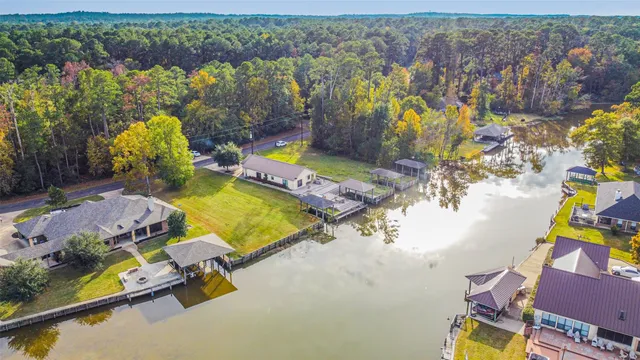 an aerial view of a house with a swimming pool