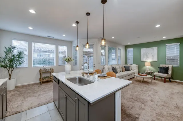 a living room with granite countertop furniture and a large window