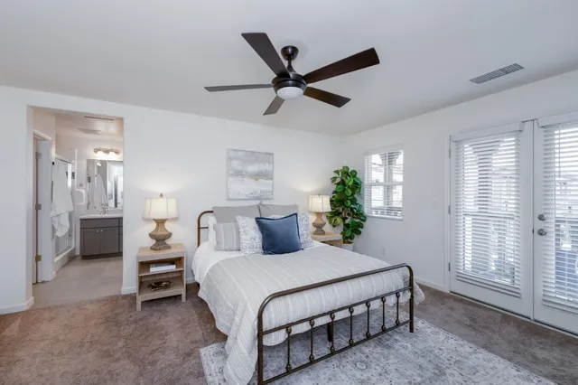 a bedroom with a bed furniture and a window