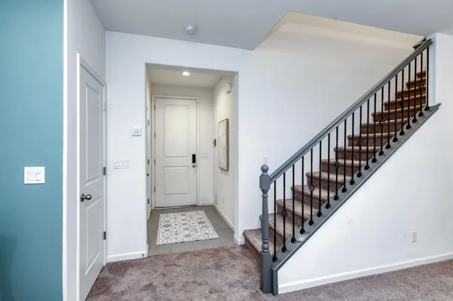 a view of an entryway with wooden floor