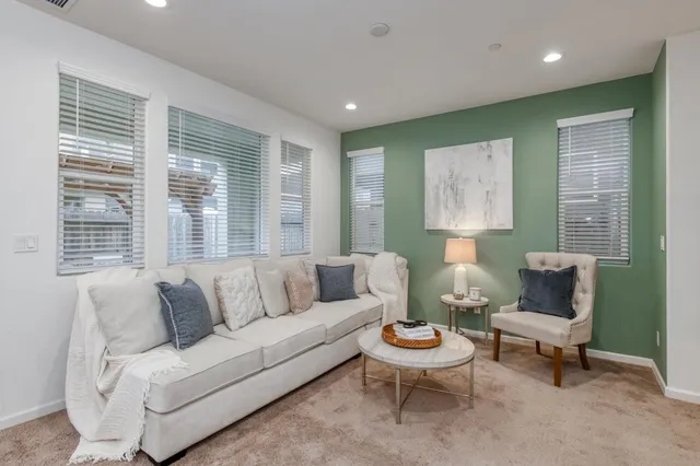 a living room with furniture and a large window