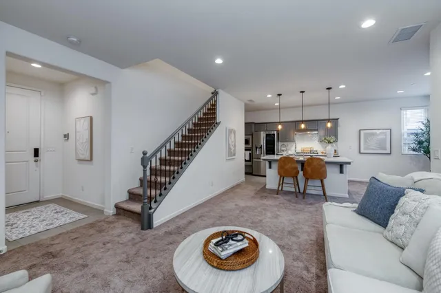 a living room with furniture and a table