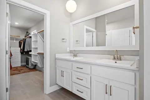 a bathroom with a sink a vanity and a mirror