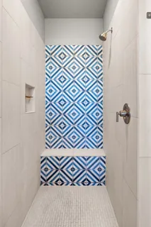 a white bath tub sitting in a bathroom