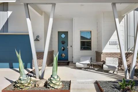 a living room with patio furniture