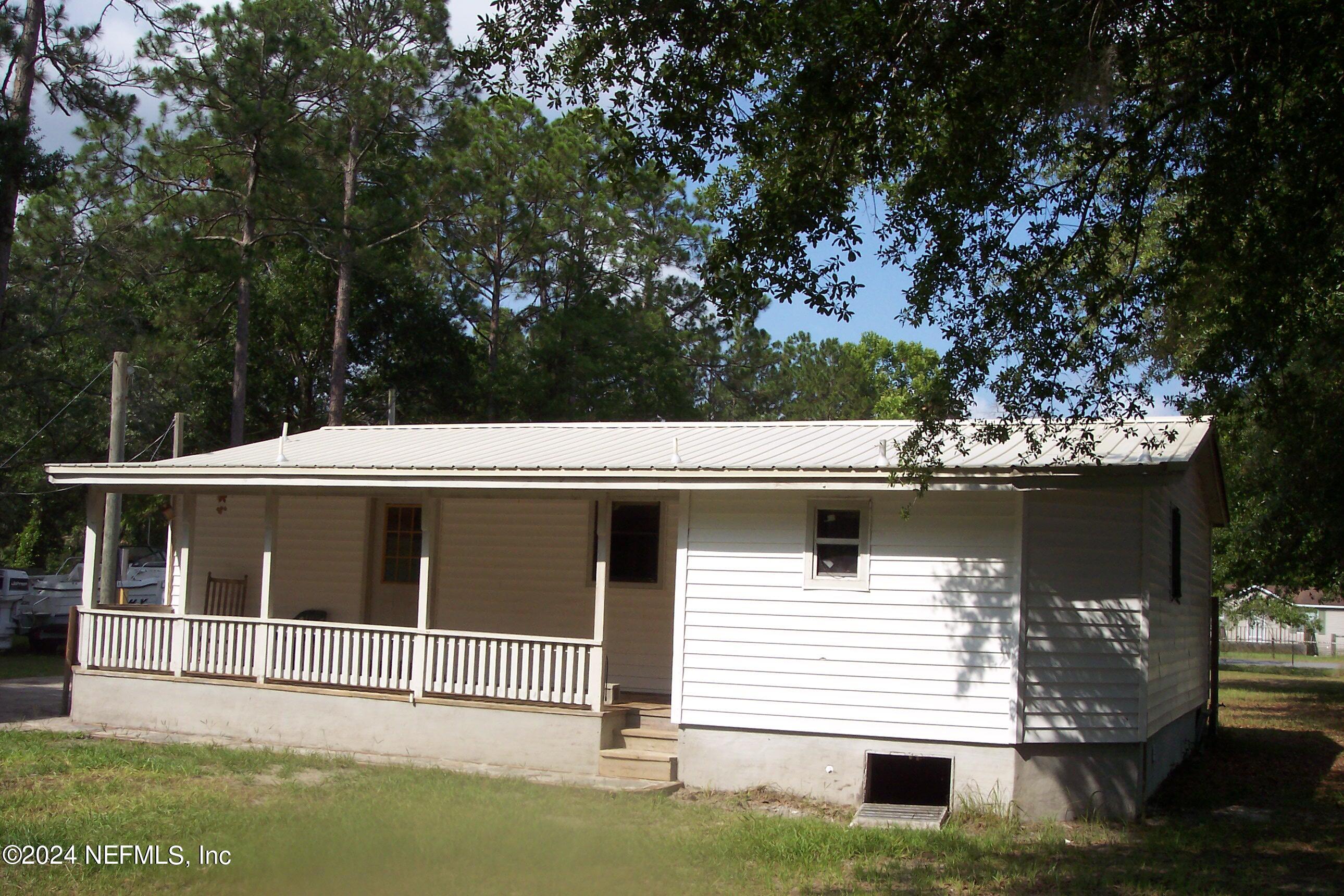 95182 Santa Juana Road Fernandina Beach, FL 32034 - Photo 2 of 20 a house with trees in the background