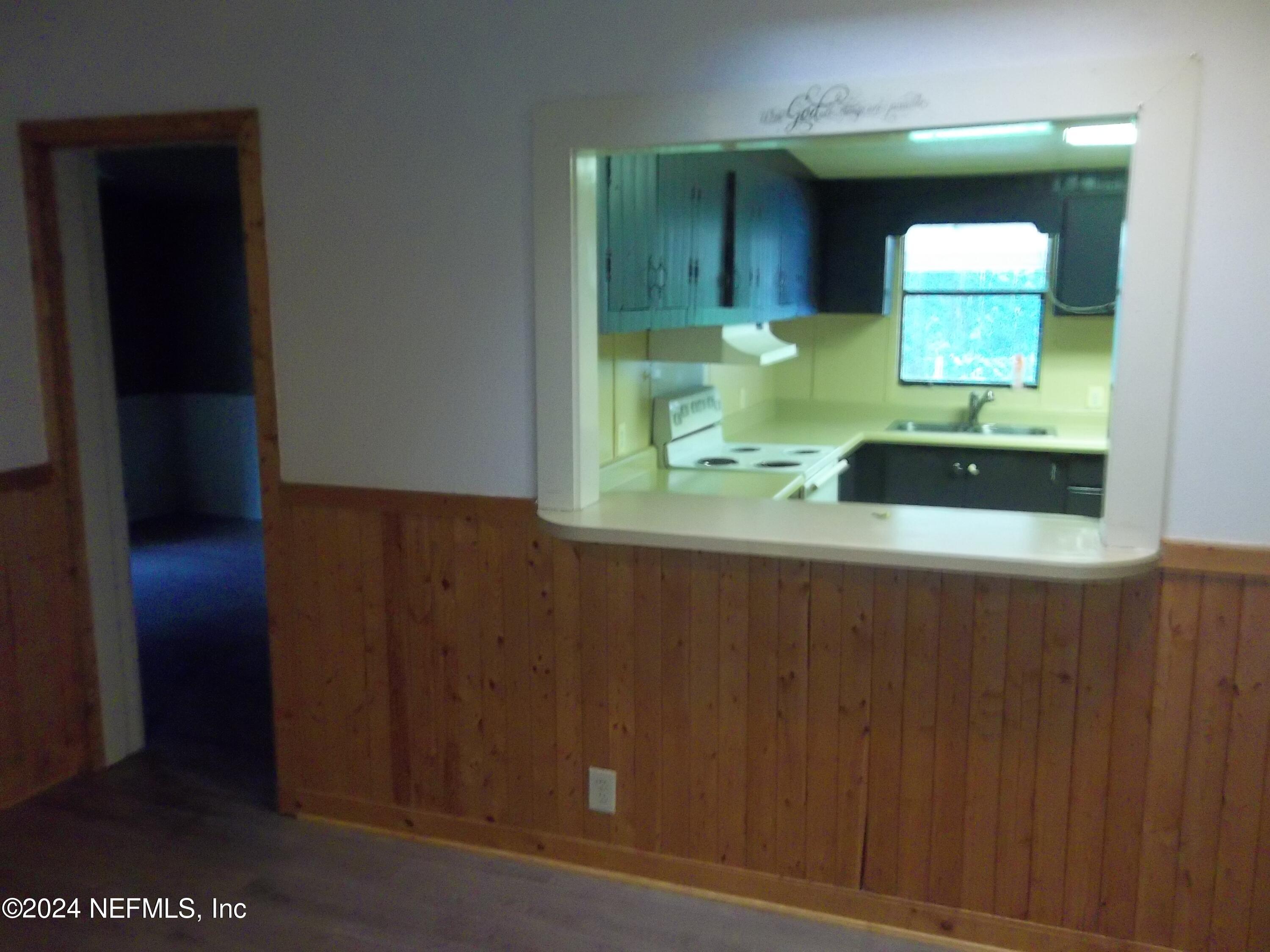 95182 Santa Juana Road Fernandina Beach, FL 32034 - Photo 4 of 20 a bathroom with a sink and a mirror