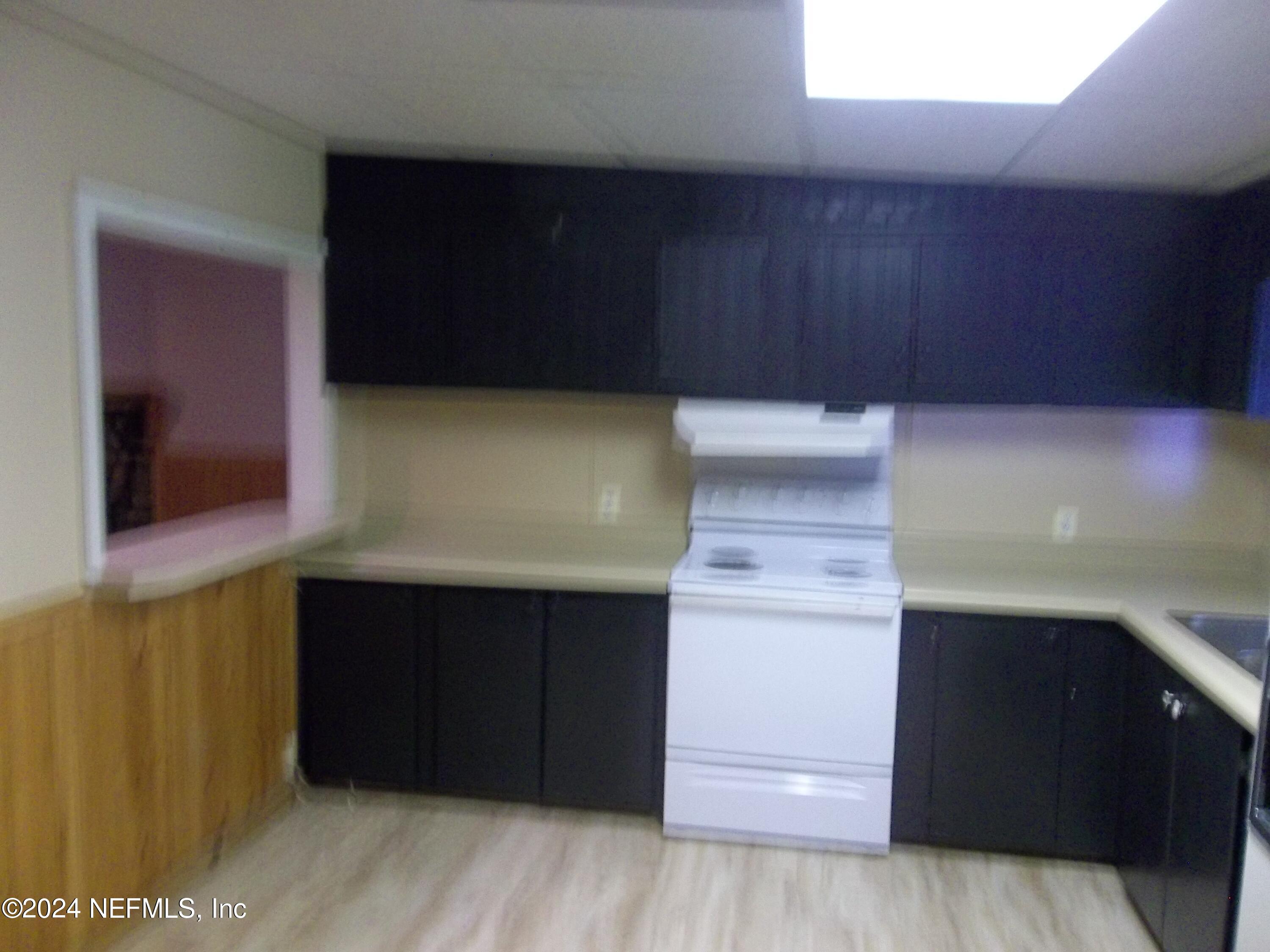 95182 Santa Juana Road Fernandina Beach, FL 32034 - Photo 5 of 20 a kitchen with a cabinets and a wooden floor