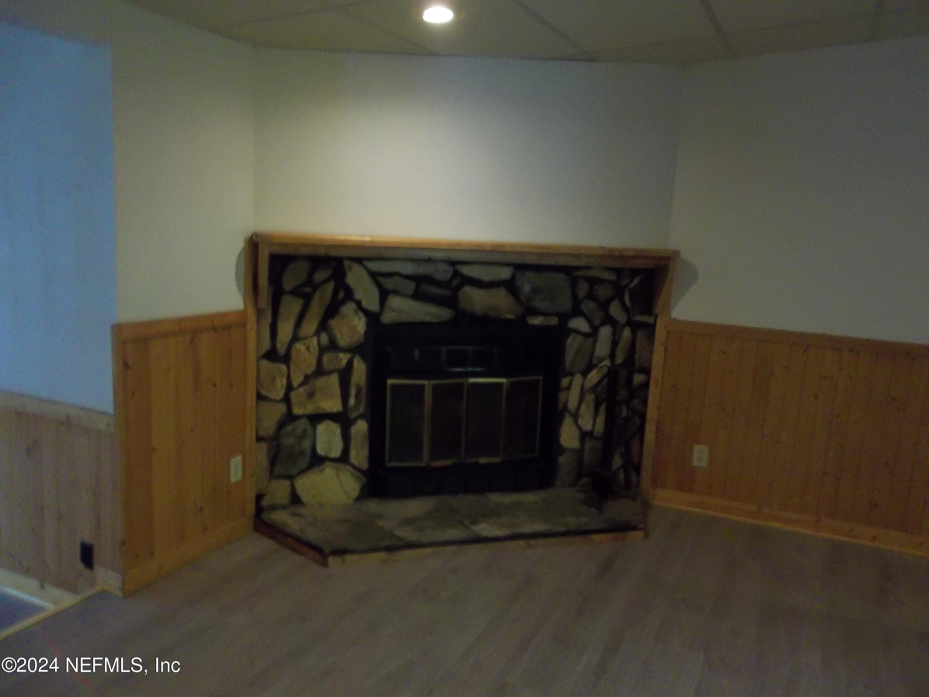 95182 Santa Juana Road Fernandina Beach, FL 32034 - Photo 8 of 20 a living room with a fireplace