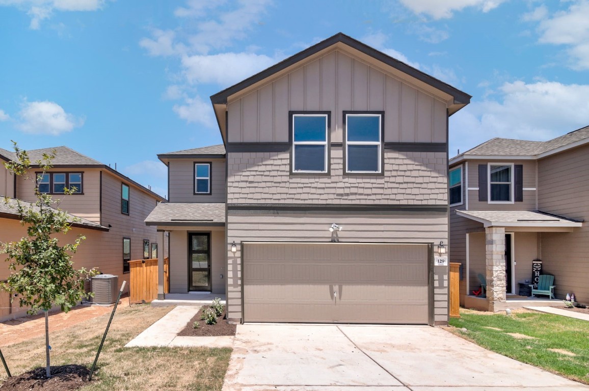 129 Lucky Texan Road Jarrell, TX 76537 - Photo 1 of 1 a front view of a house with garden