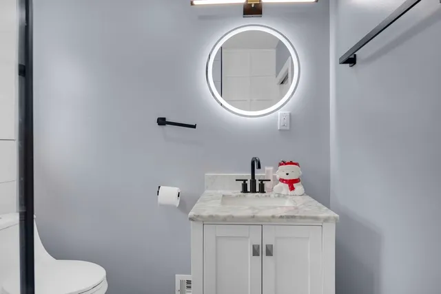 a bathroom with a toilet and a sink