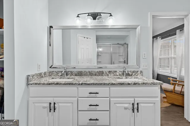 a bathroom with a sink and a mirror