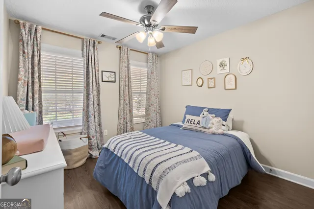 a bedroom with bed and a window