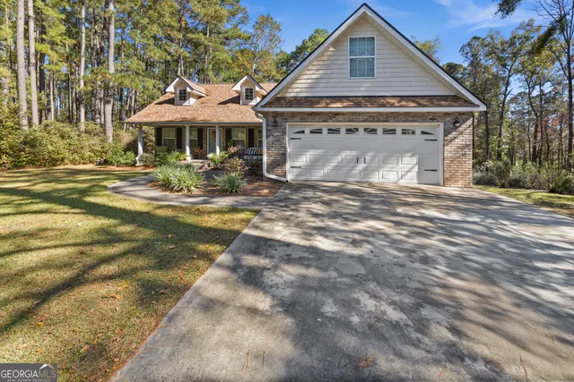 a front view of a house with yard patio and balcony