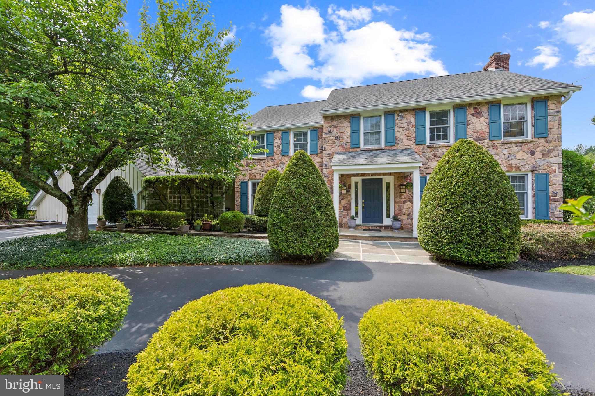 717 Evans Road Lower Gwynedd, PA 19002 - Photo 1 of 35 front view of a house with a garden