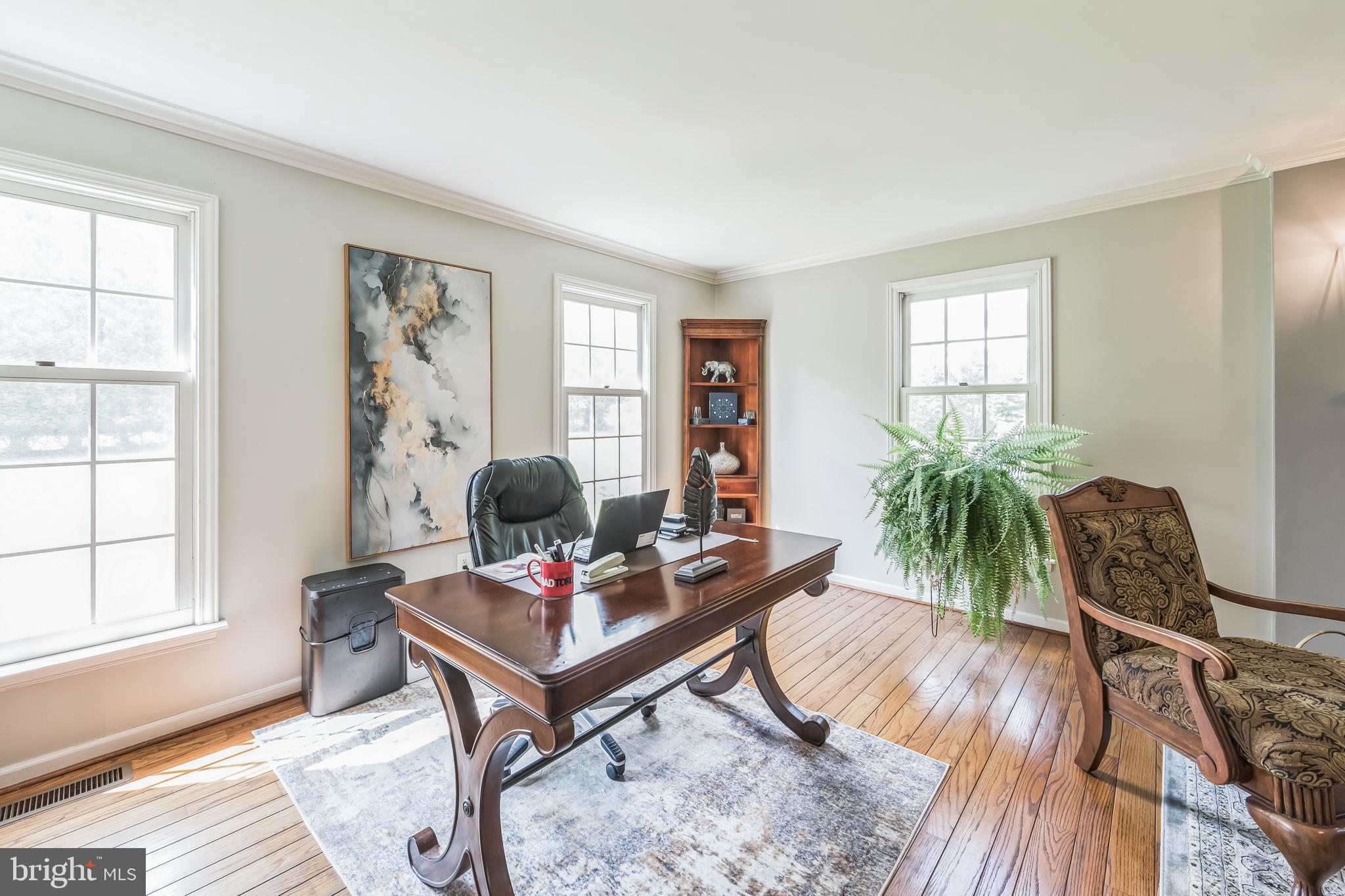 717 Evans Road Lower Gwynedd, PA 19002 - Photo 13 of 35 a living room with furniture and a window