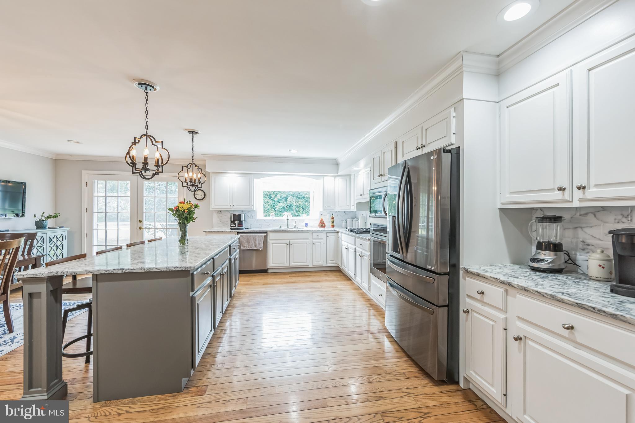 717 Evans Road Lower Gwynedd, PA 19002 - Photo 15 of 35 a kitchen with refrigerator a sink and cabinets
