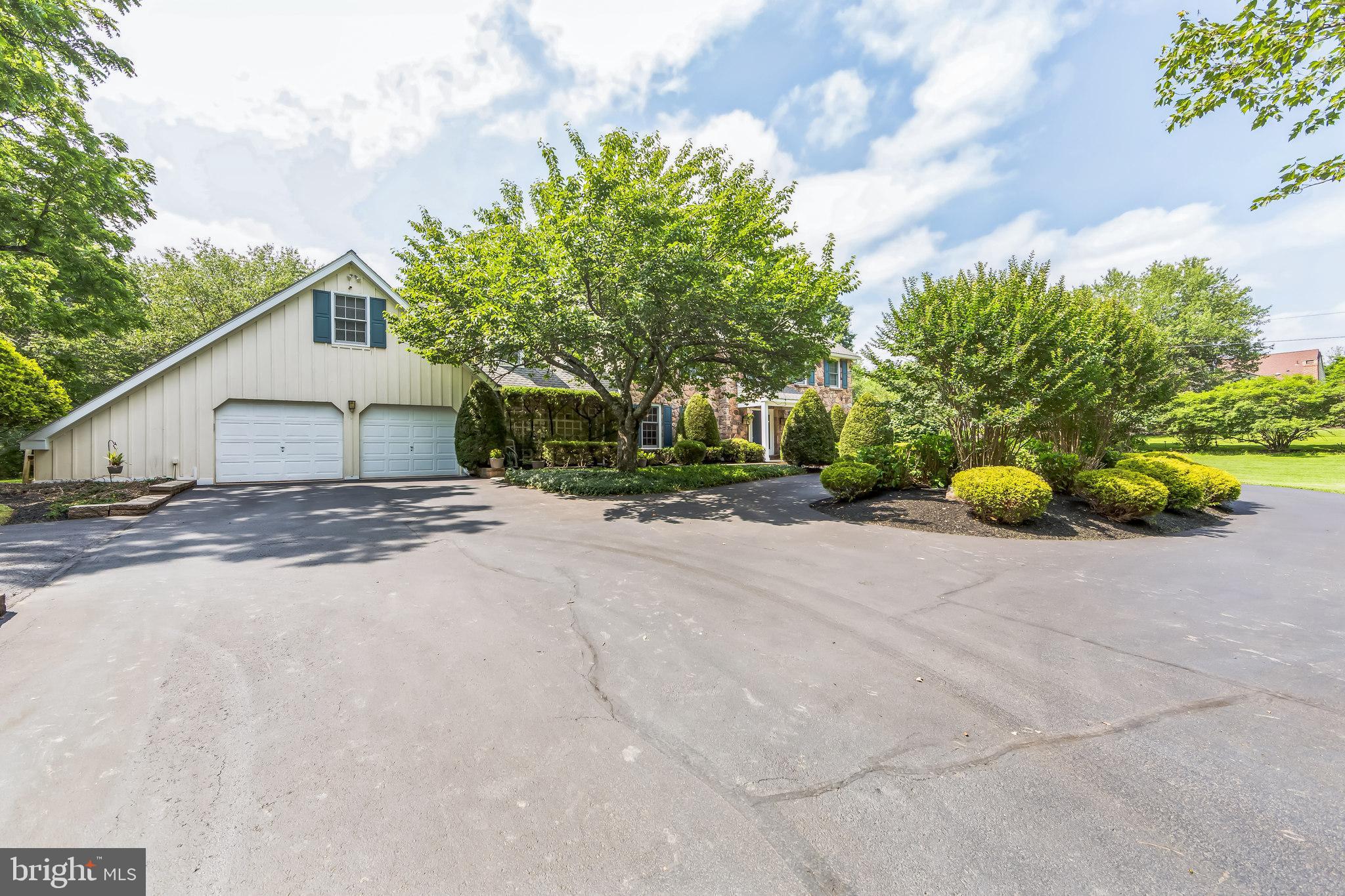 717 Evans Road Lower Gwynedd, PA 19002 - Photo 2 of 35 a house with trees in front of it