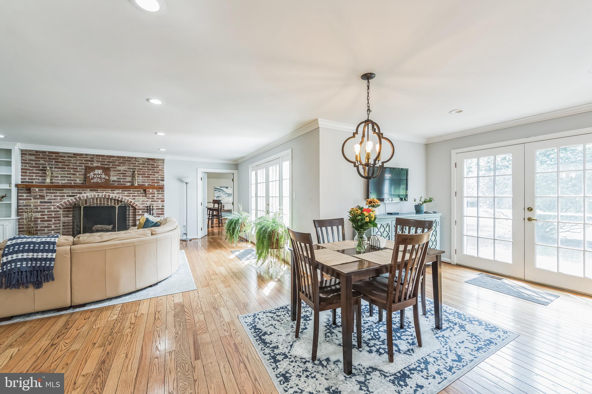 717 Evans Road Lower Gwynedd, PA 19002 - Photo 22 of 35 a view of a dining room with furniture window and wooden floor