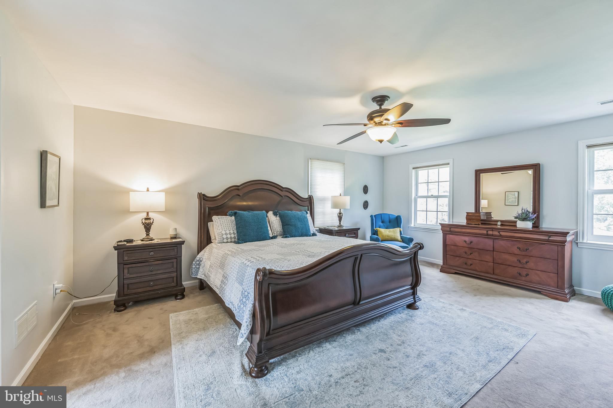 717 Evans Road Lower Gwynedd, PA 19002 - Photo 23 of 35 a bedroom with a bed and a chandelier