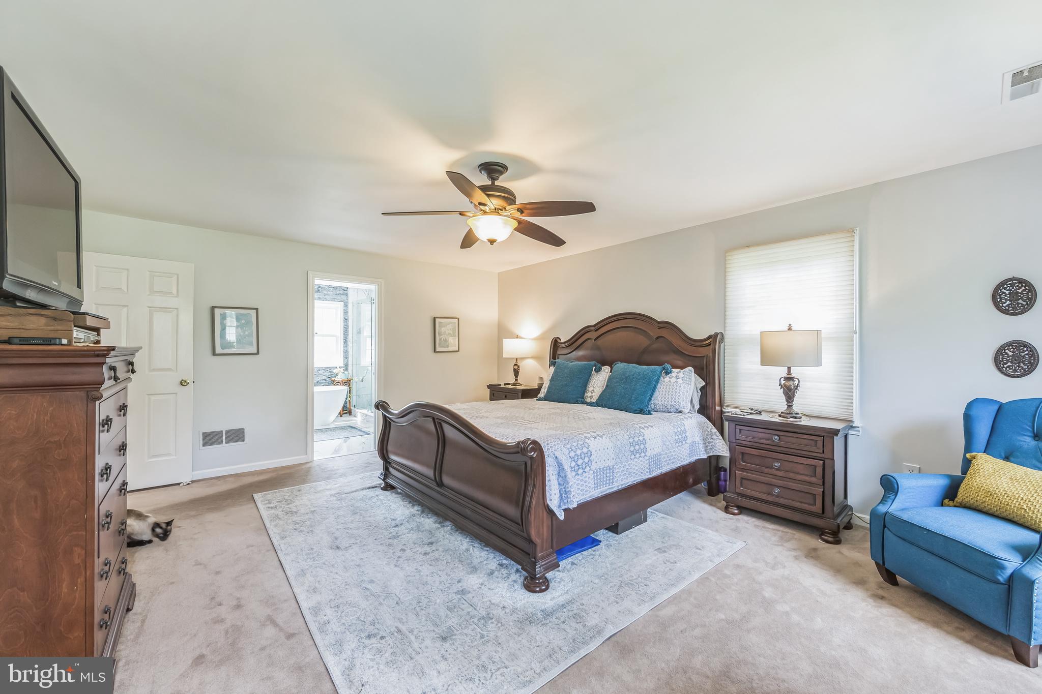 717 Evans Road Lower Gwynedd, PA 19002 - Photo 24 of 35 a bedroom with a bed couch and window