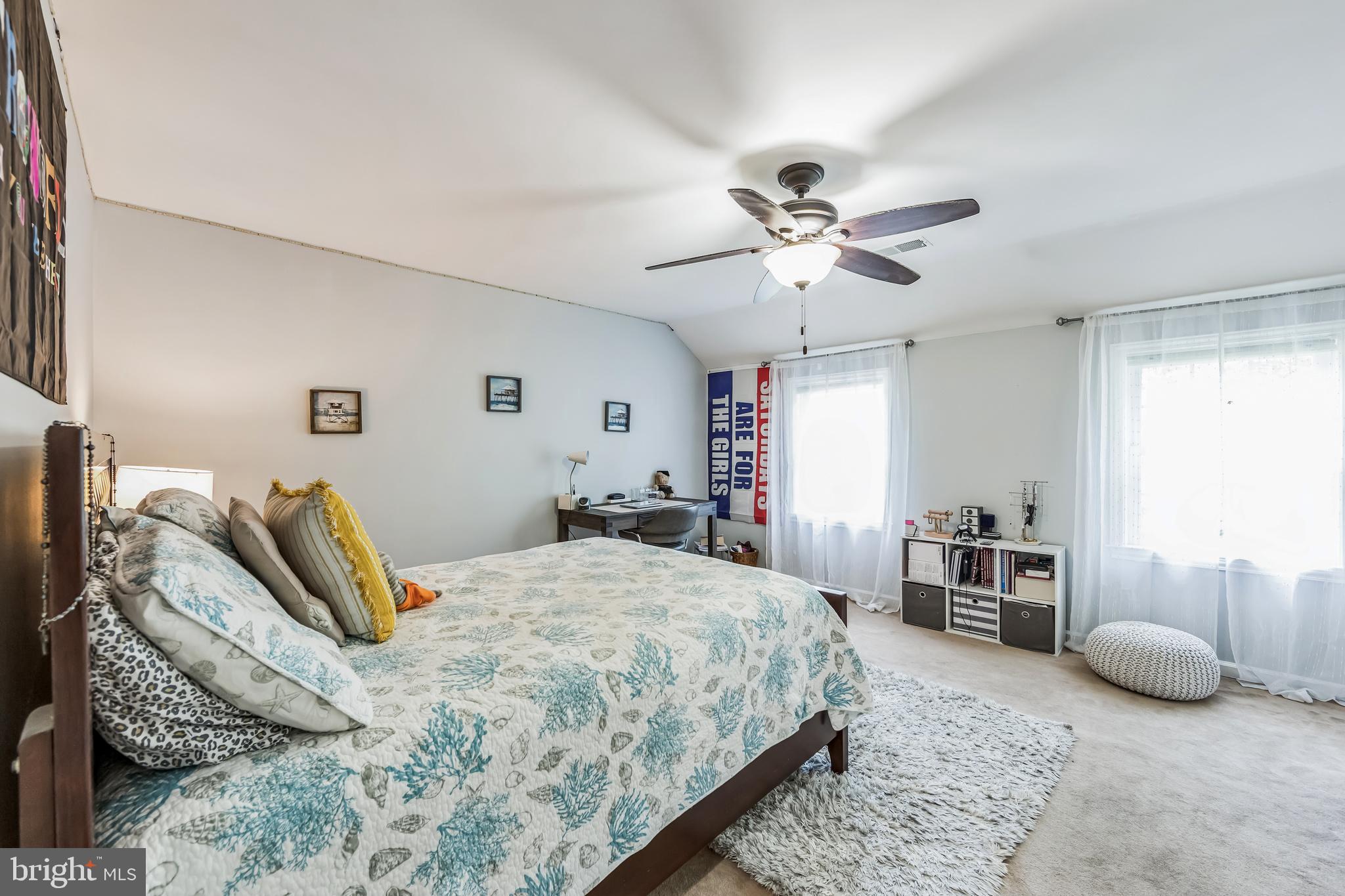 717 Evans Road Lower Gwynedd, PA 19002 - Photo 26 of 35 a bedroom with a bed and a chandelier