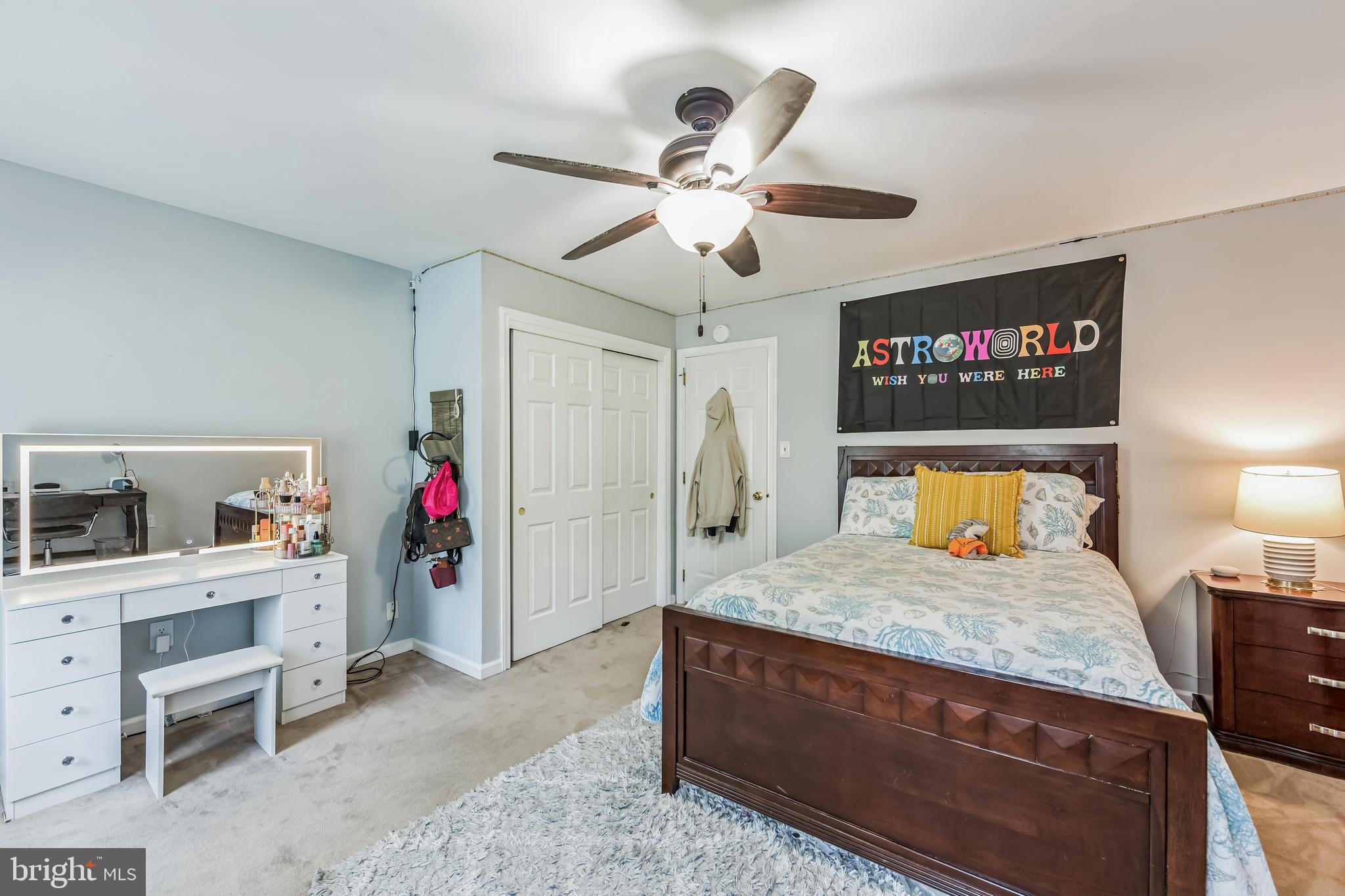 717 Evans Road Lower Gwynedd, PA 19002 - Photo 27 of 35 a bedroom with a bed and a chandelier