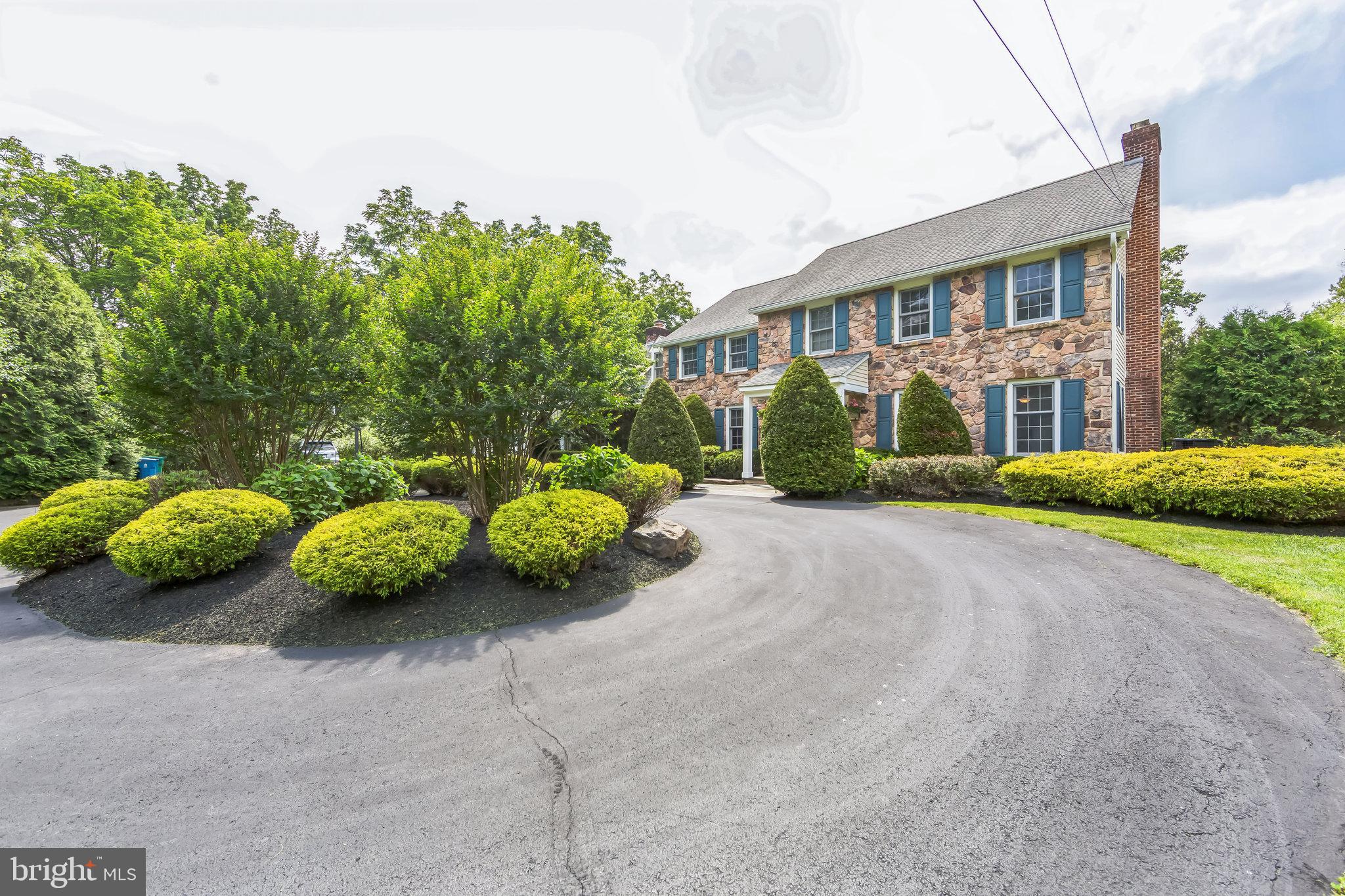 717 Evans Road Lower Gwynedd, PA 19002 - Photo 3 of 35 a front view of a house with garden