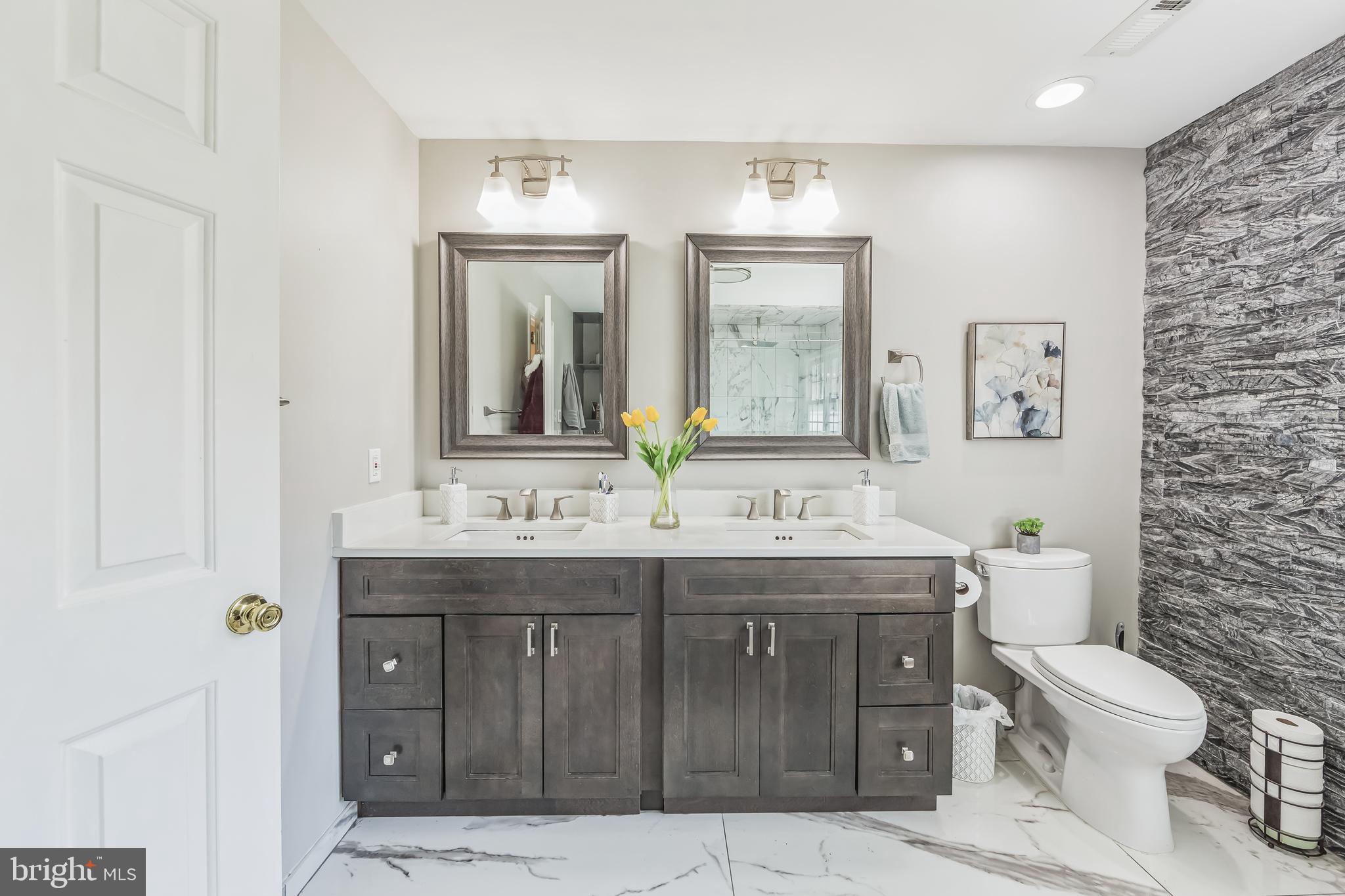 717 Evans Road Lower Gwynedd, PA 19002 - Photo 31 of 35 a bathroom with a granite countertop toilet sink and mirror